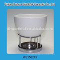 White ceramic tea canister with plastic cover